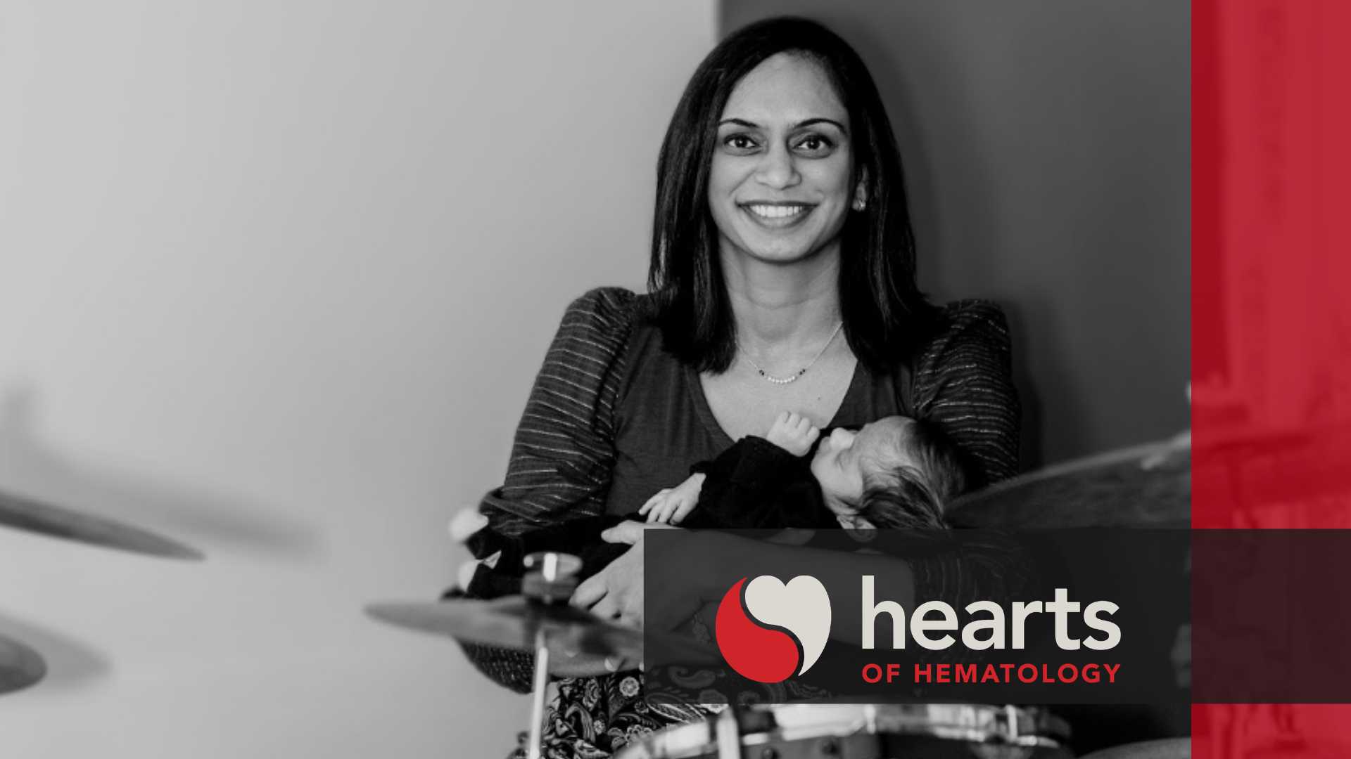 A photo of Priyal Patel and her baby with the hearts of hematology logo and branding