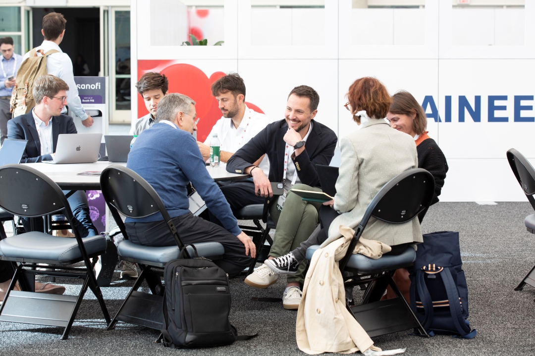 Trainees talk with each other in the trainee lounge.