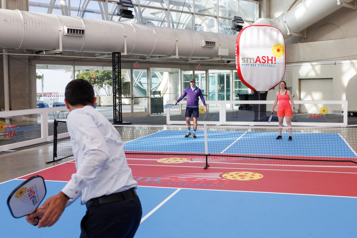 attendees play ASH branded pickleball