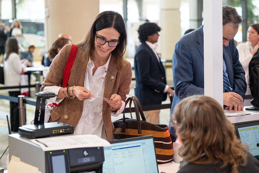 A group of people of at the ASH registration kiosk during the Annual Meeting